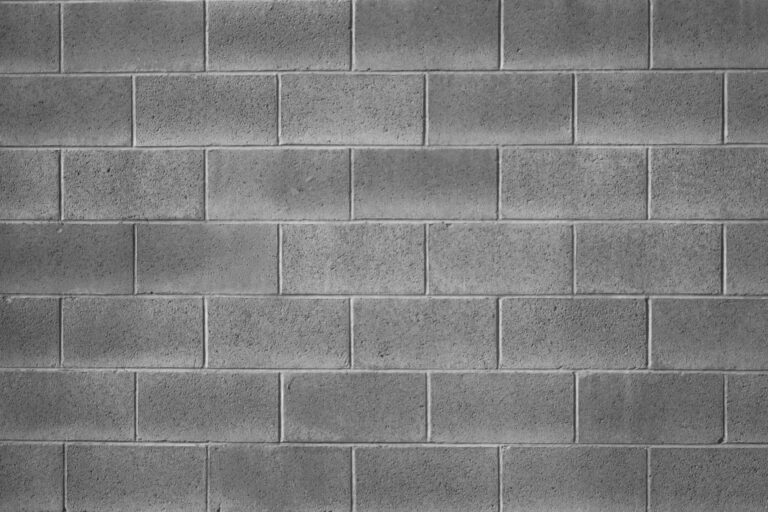 Reinforced concrete masonry block wall designed for strength and structural stability in commercial and residential applications