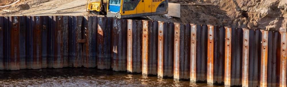 Sheet pile retaining walls